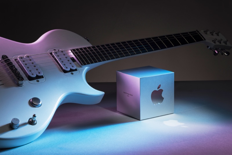 Apple Design Award trophy beside an electric guitar